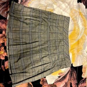 I am selling a large plaid black, grey and white skirt